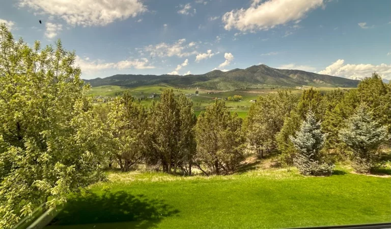 Mountain and valley view through freshly washed windows