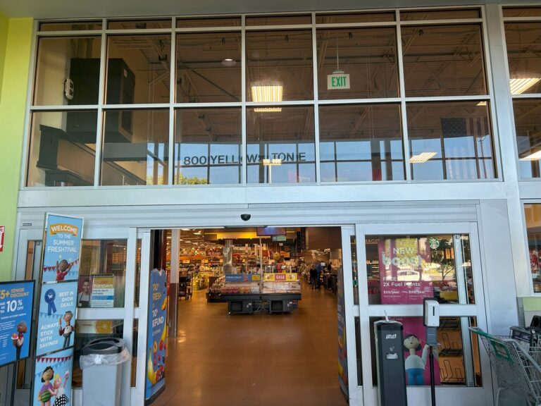 Commercial entryway with clean upper windows and glass doors