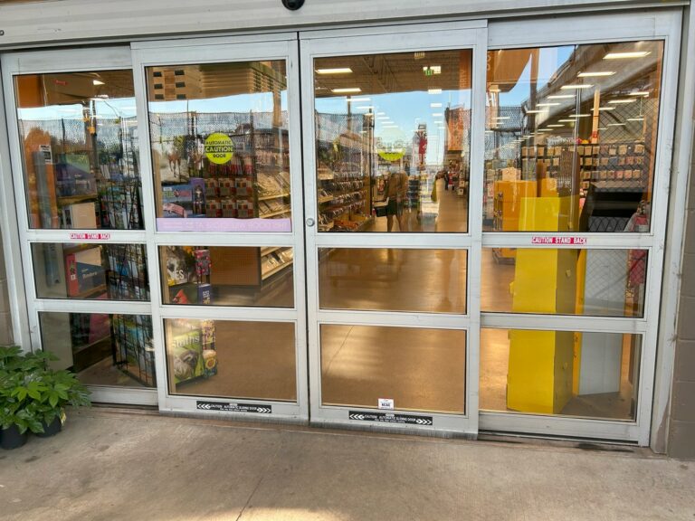 Spotless sliding glass entry doors at a retail store
